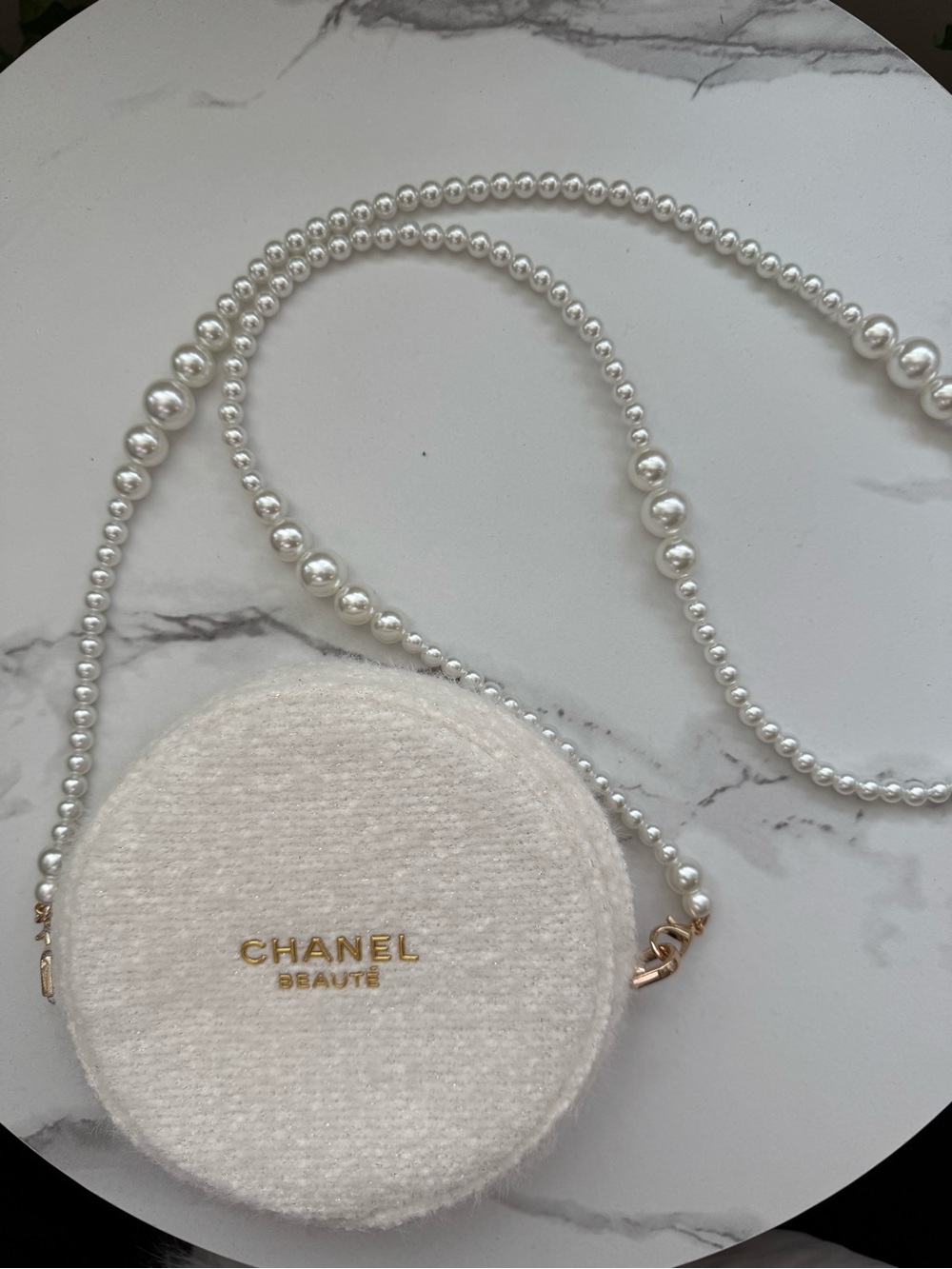 GWP White round textured beaute cosmetic case with gold logo